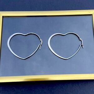 Silver heart shaped hoop earrings